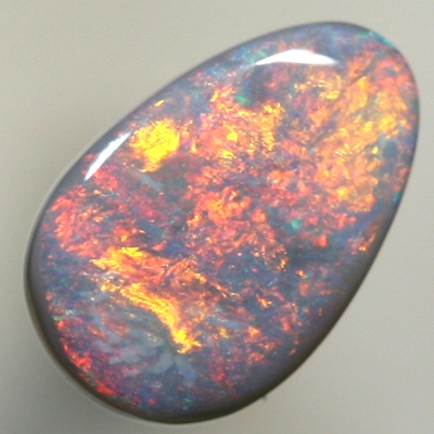 SOLID SEMI BLACK OPAL Fire red and copper orange sweeps over the opal